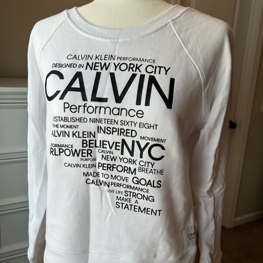 Great Calvin Klein sweater has on back small dot see picture. Fits Adult S